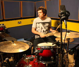 The software allows drummers to set their own pace with pre-programmed music