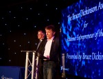 QMUL alumnus Bruce Dickinson presenting the The Bruce Dickinson Award for Academic Entrepreneur of the Year