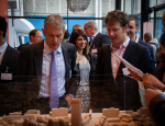 President and Principal Simon Gaskell looking over the model of Whitechapel development