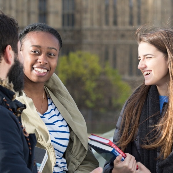 three students talking 