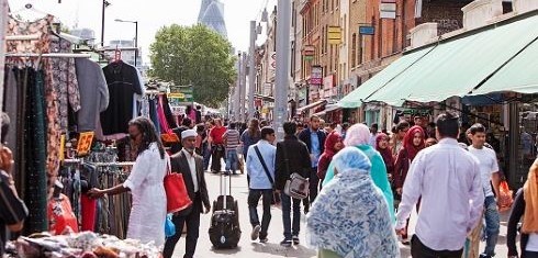People at street market in Whitechapel, East London