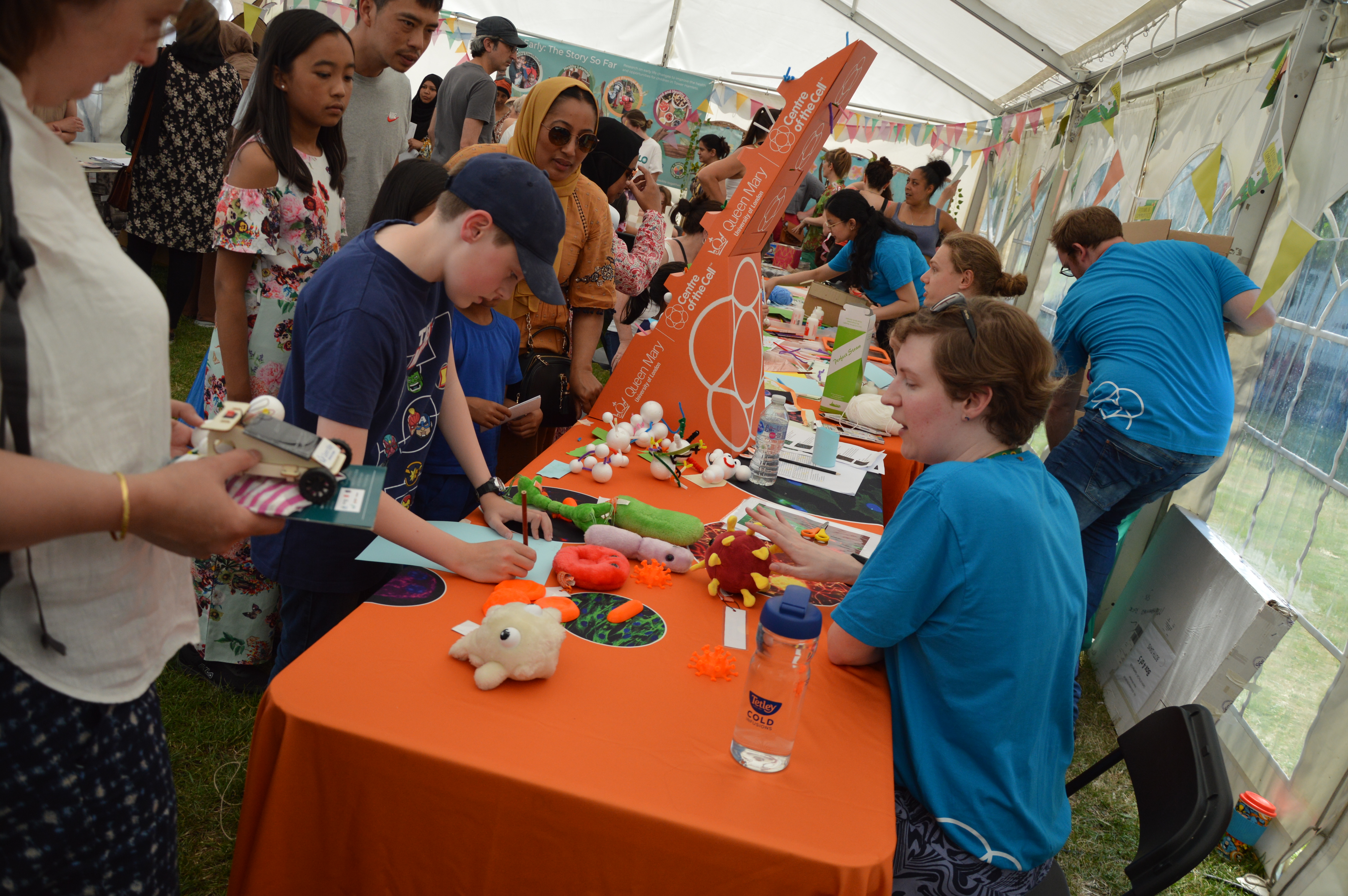 Staff from Centre of the Cell chat to visitors at the QMUL Festival of Communities