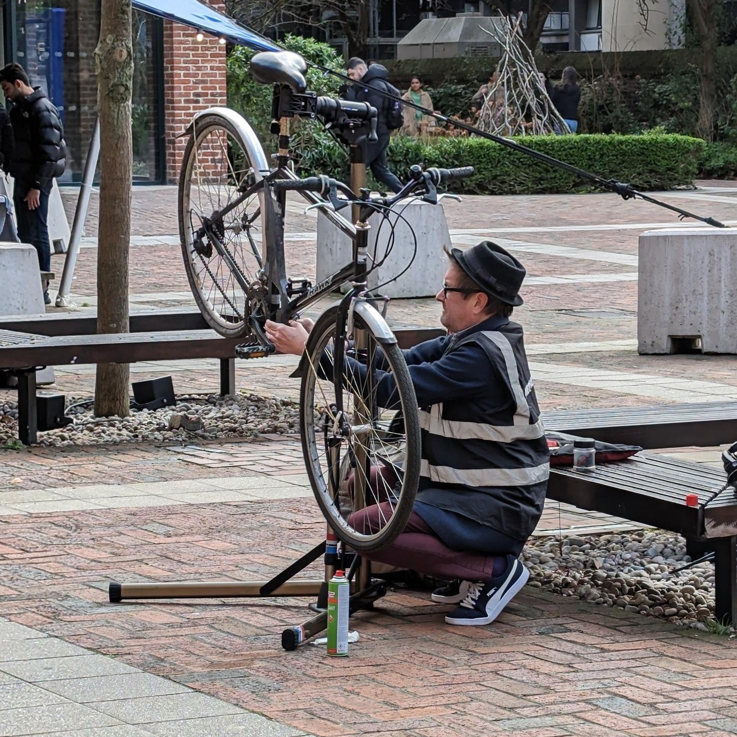 A mechanic from Dr Bike doing a check-up on a student's bike.
