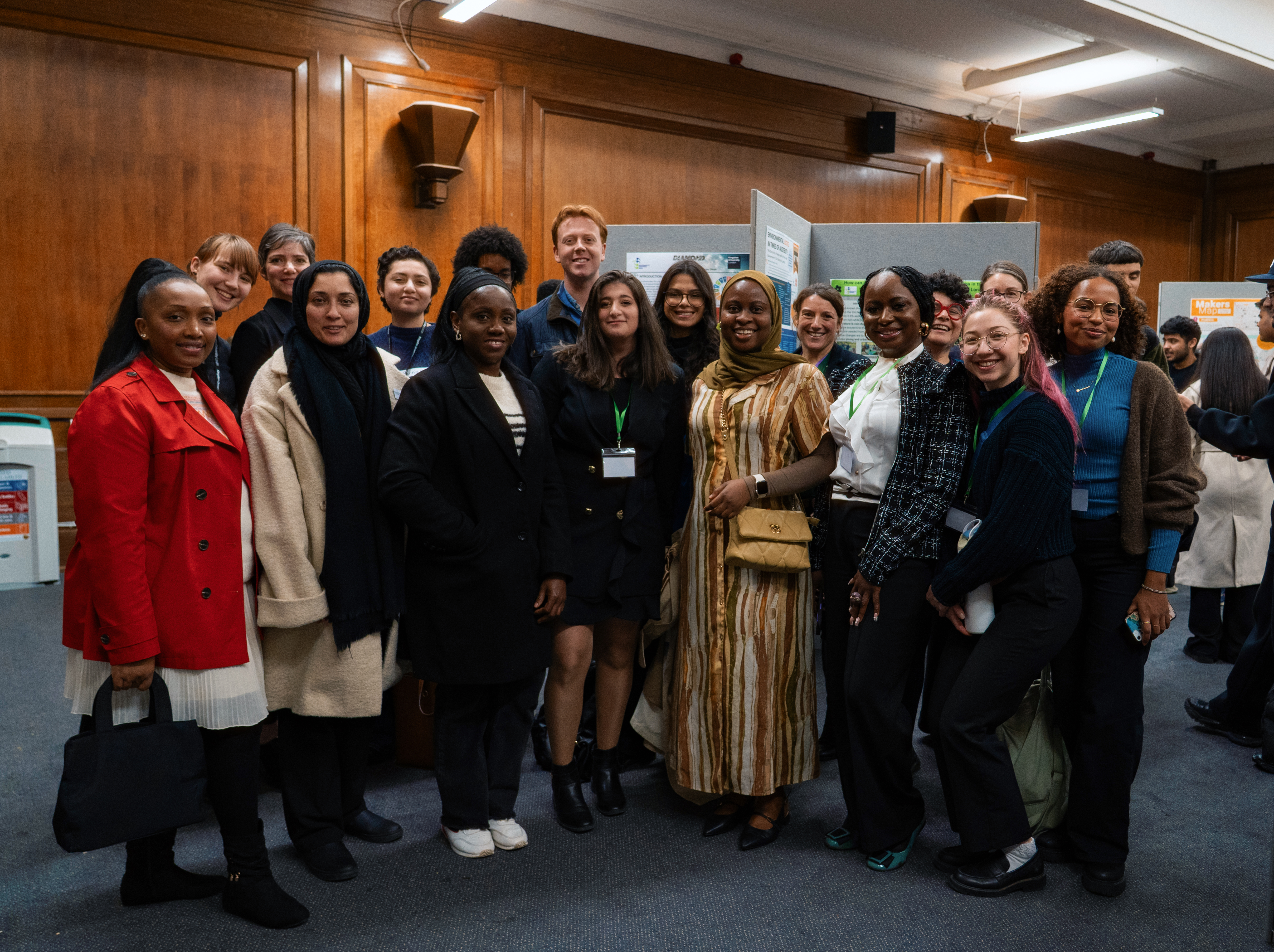A group of student presenters gathered at the poster exhibition