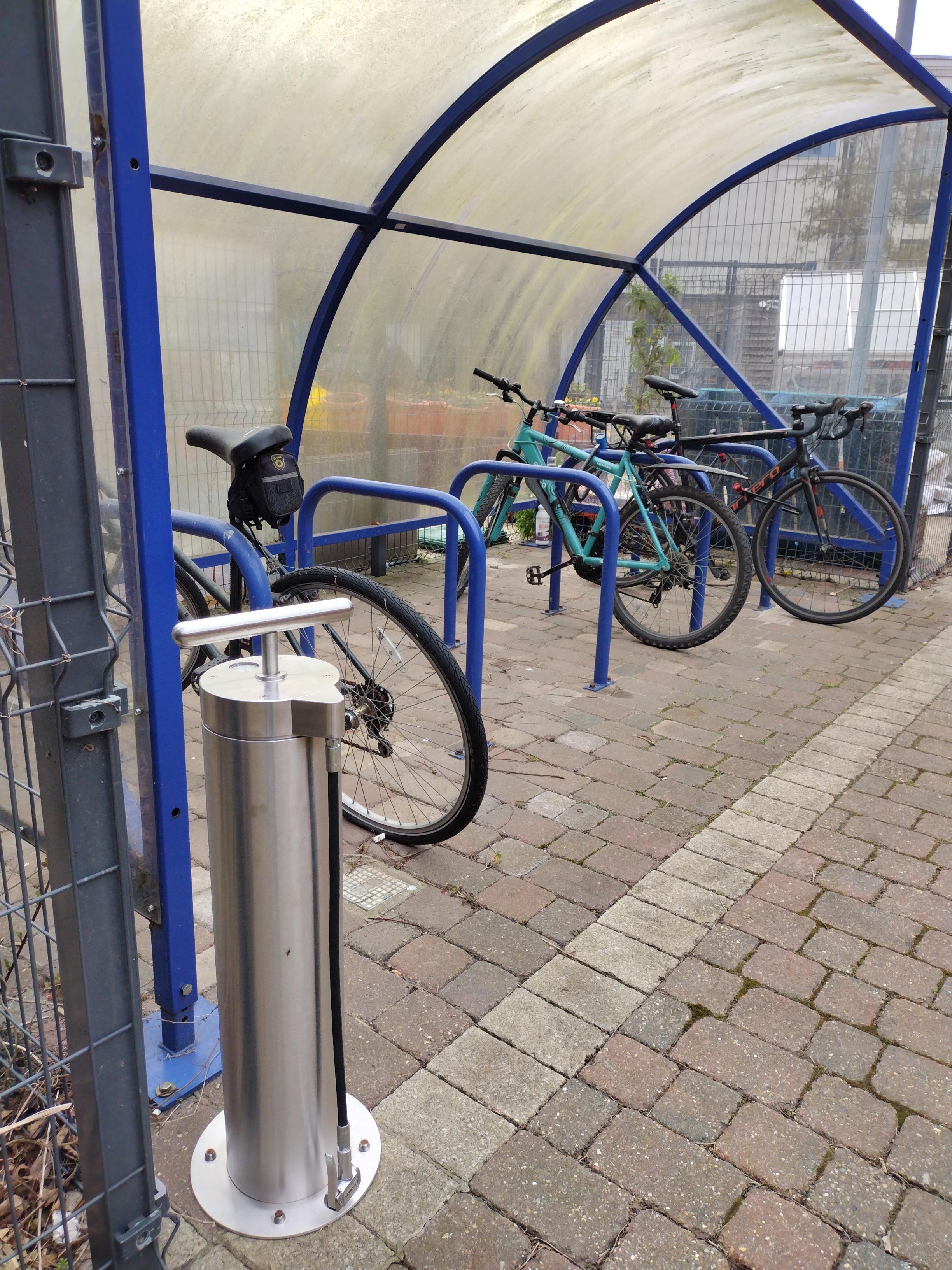 A bike pump available in a bike shelter