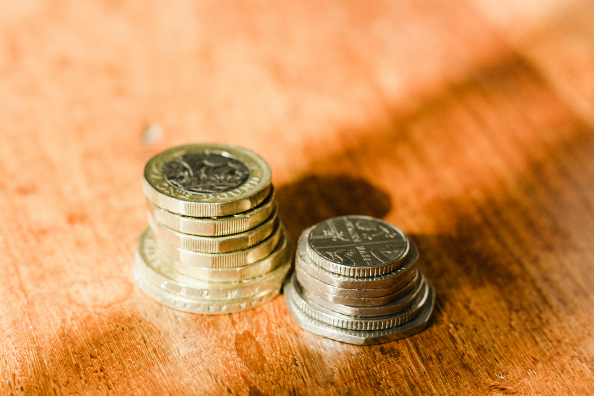 Stacks of British coins on a table