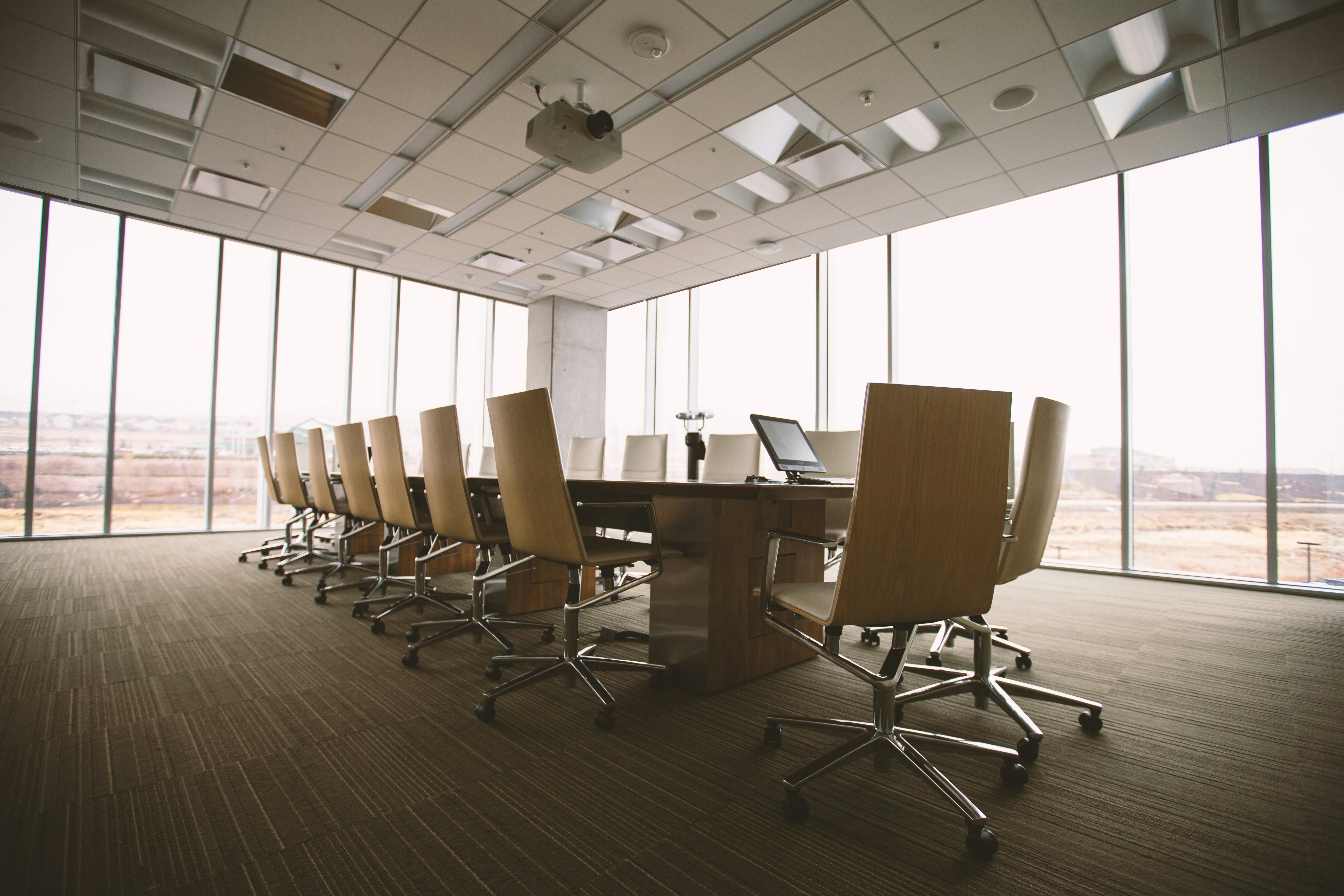 Long table surrounded by chairs
