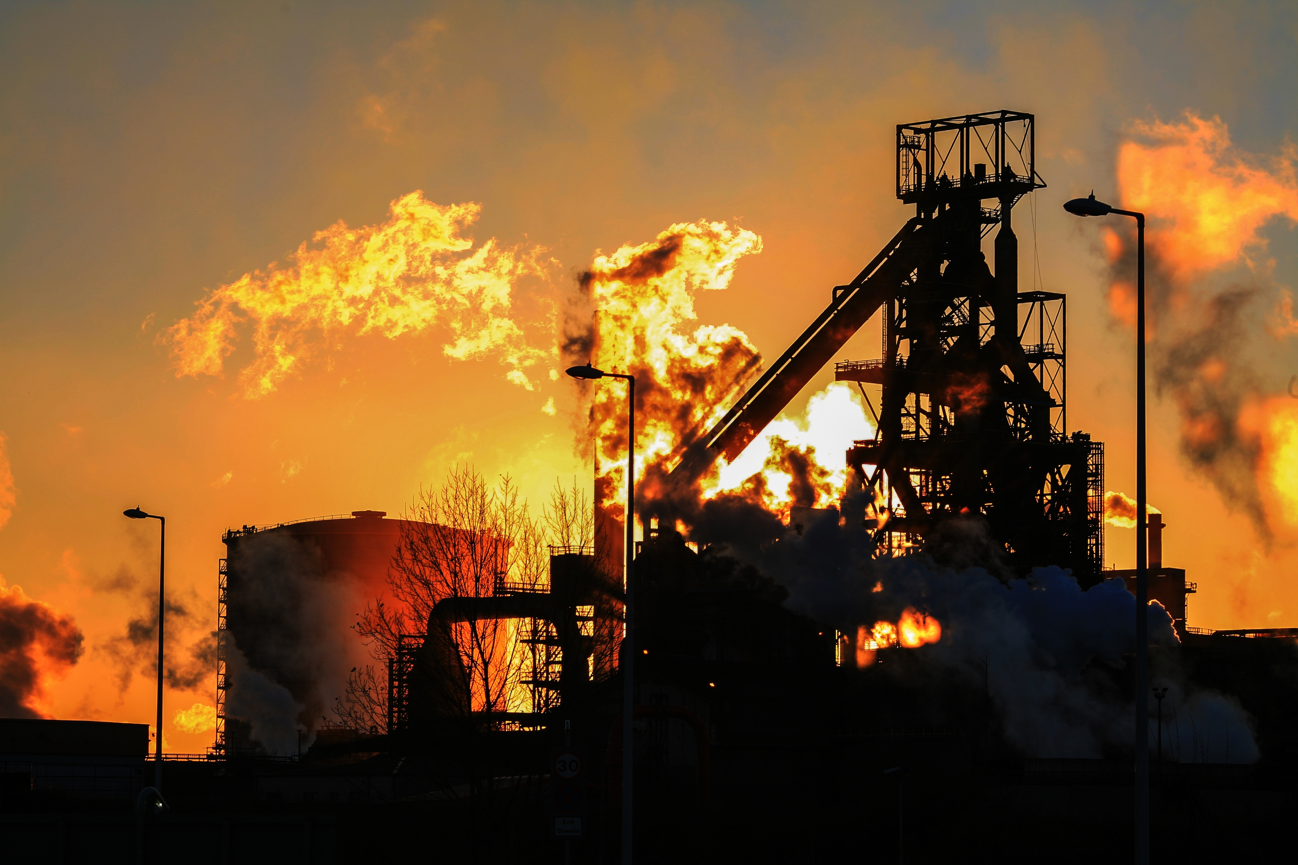 Port Talbot, South Wales, UK. Atmospheric sunset photo of the silhouetted blast furnace skyline of steel works Tata Steel in Port Talbot, South Wales, UK Royalty-free stock photo ID: 2417458263 Photo Description Stock Photo ID: 2417458263  Port Talbot, South Wales, UK 11 22 2013 Atmospheric sunset photo of the silhouetted blast furnace skyline of steel works Tata Steel in Port Talbot, South Wales, UK