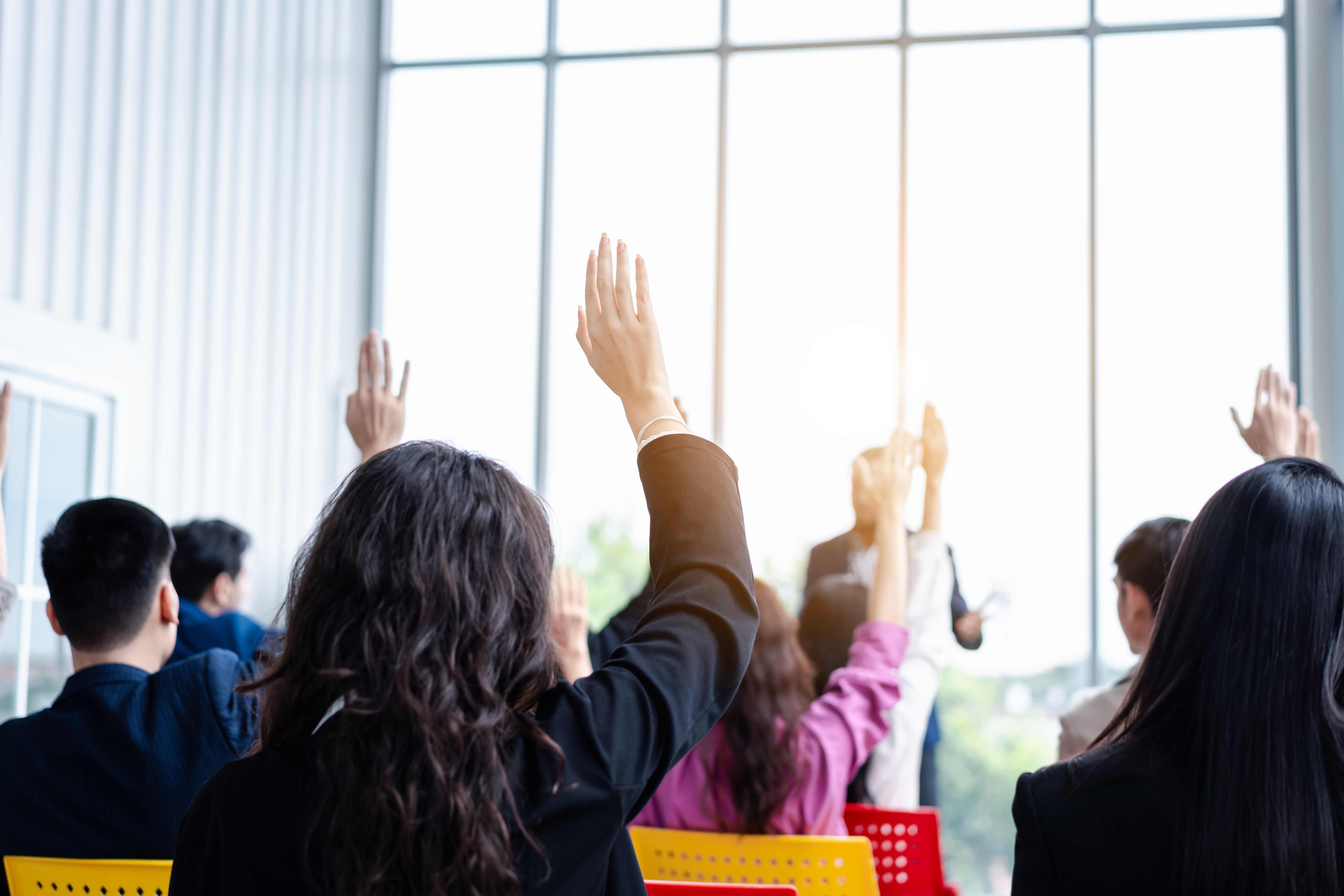 A group of people raising their hands