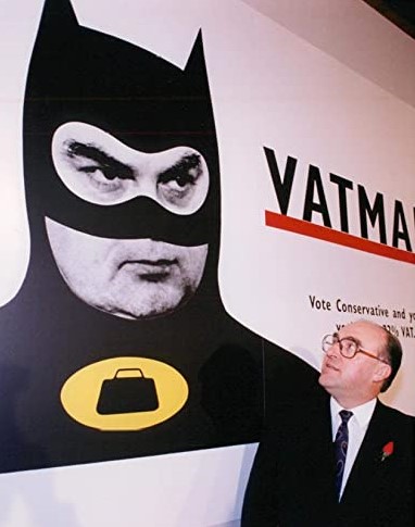 John Smith next to 'Vatman' poster, depicting the Chancellor, Norman Lamont, as 'Vatman'.