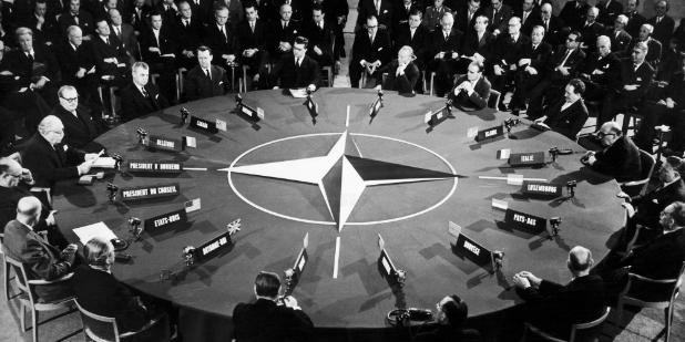 Black and White photo of meeting of NATO council
