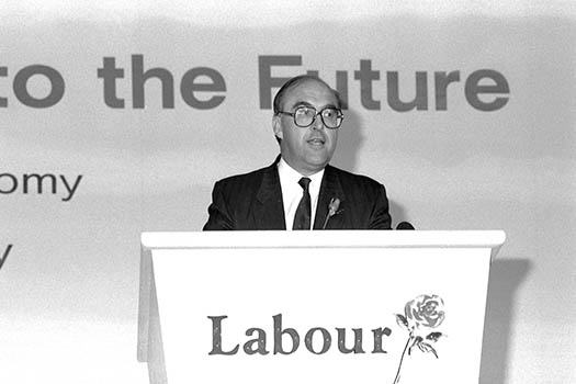 Photo of the then Labour leader, John Smith, speaking from a lectern with 'The Future' written behind him