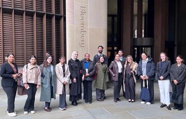 Another photo of Queen Mary qLegal students taking a group photo outside of the Bloomberg offices.