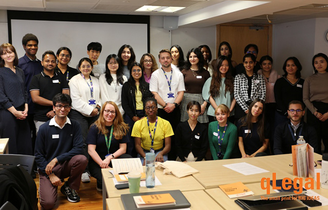 qLegal staff and new students taking a group photo in a room in CCLS.