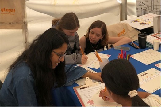 Children doing activities with qLegal at the Queen Mary Festival of Communities 2022