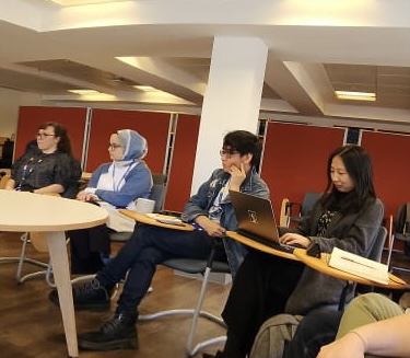 Attendees listening to speakers at the Doctoral Seminar and Reading Group