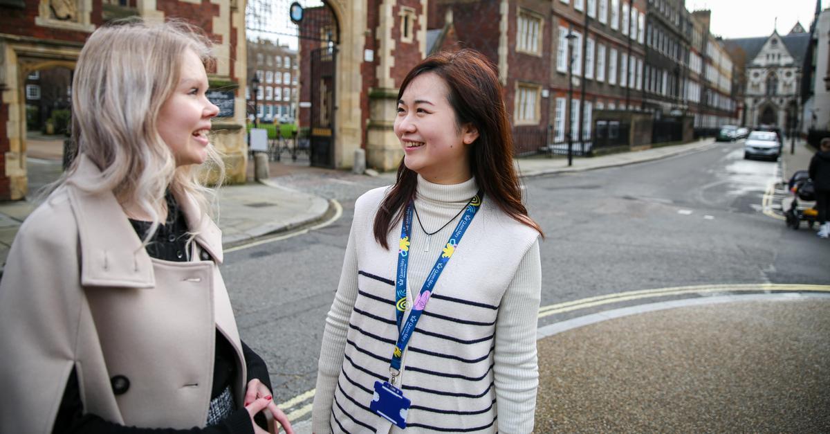 Two students outside a campus building