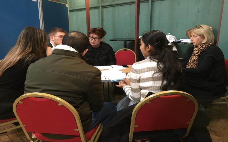 A group of students sitting at the table 