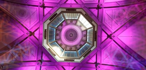 The roof of the Octagon with pink lighting