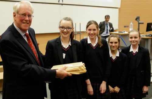Dr The Hon Alexander Todd presenting the winning team with their award