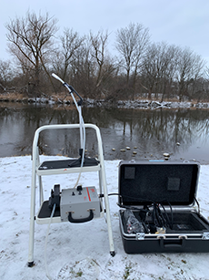 Machinery on a metal stool outside