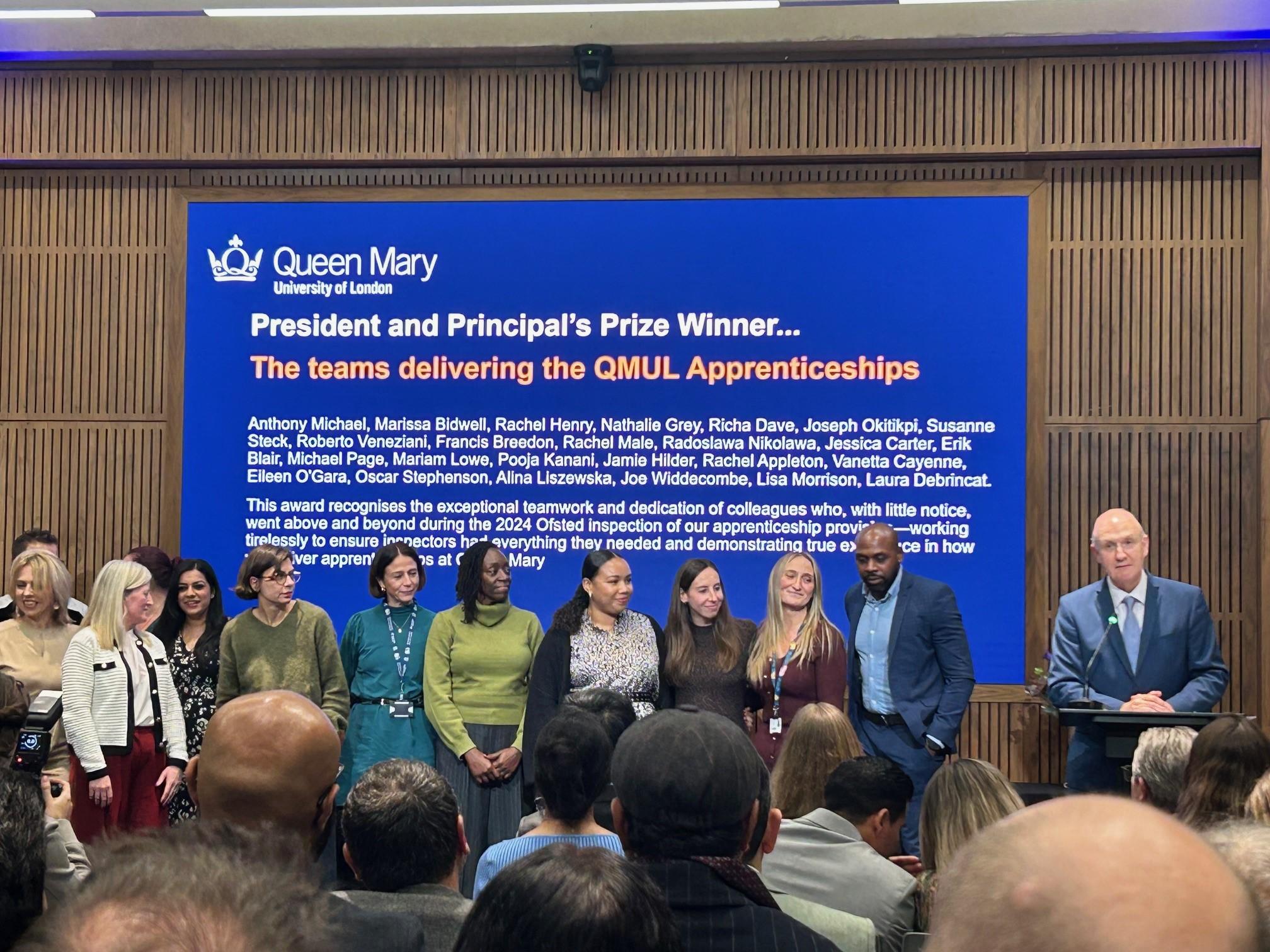 The apprenticeships team on stage receiving their award