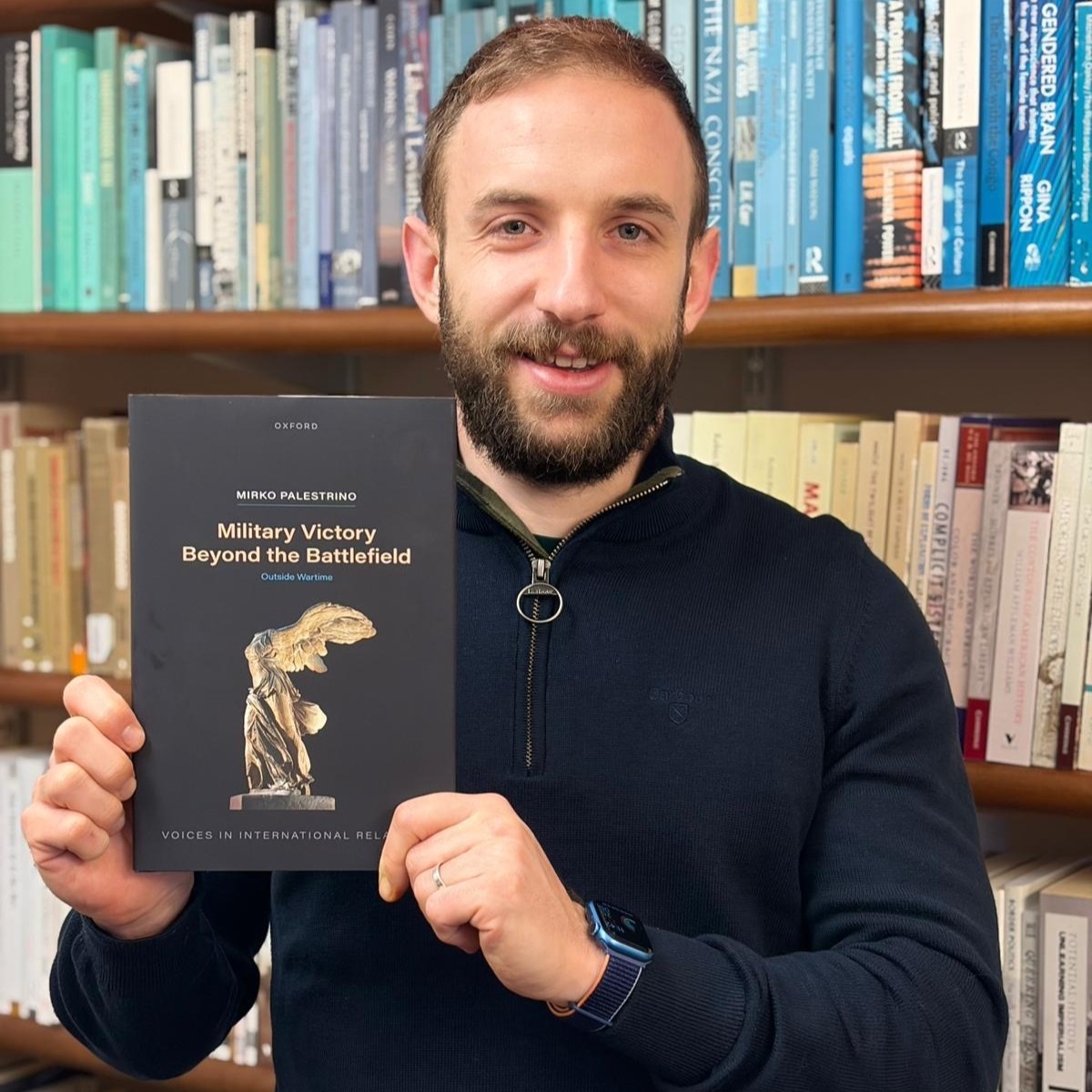 Mirko Palestrino holding his book 