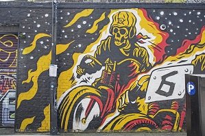 an image of a painting of a skeleton on a motorbike an example of East End Art