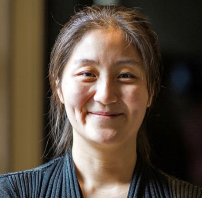 Chelsea Zhang-Anegbeh, Joint Education Institute Administrator, smiling at the camera.