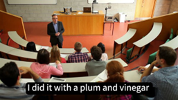 Screen shot of a Lecturer teaching with dubious closed captions