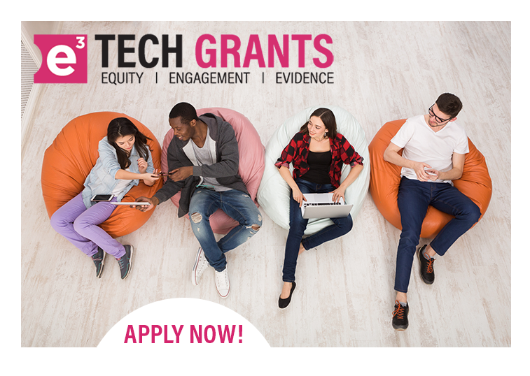 A group of four young people sitting on colourful bean bags using laptops and mobile devices.