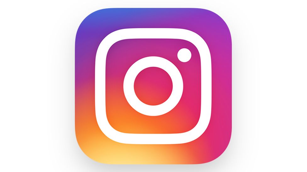 Instagram logo. A  simplified representation of a camera, set against a vibrant, multi-colored gradient background.