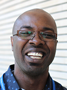 Jonathan is looking at the camera and smiling