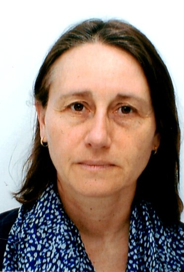 Marie-Luce looking towards camera. Passport style photo with white background.