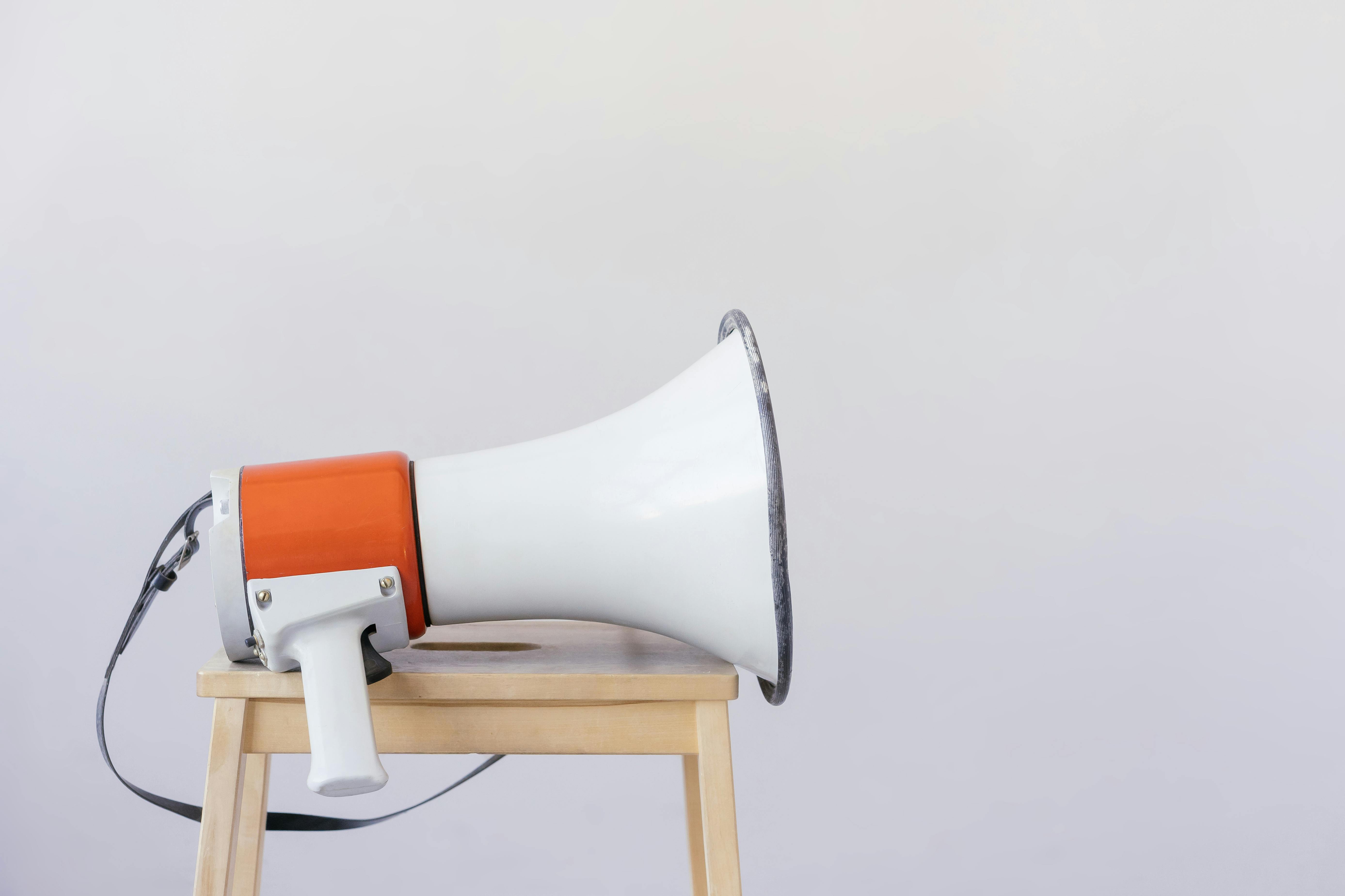 A megaphone resting on a wooden stool