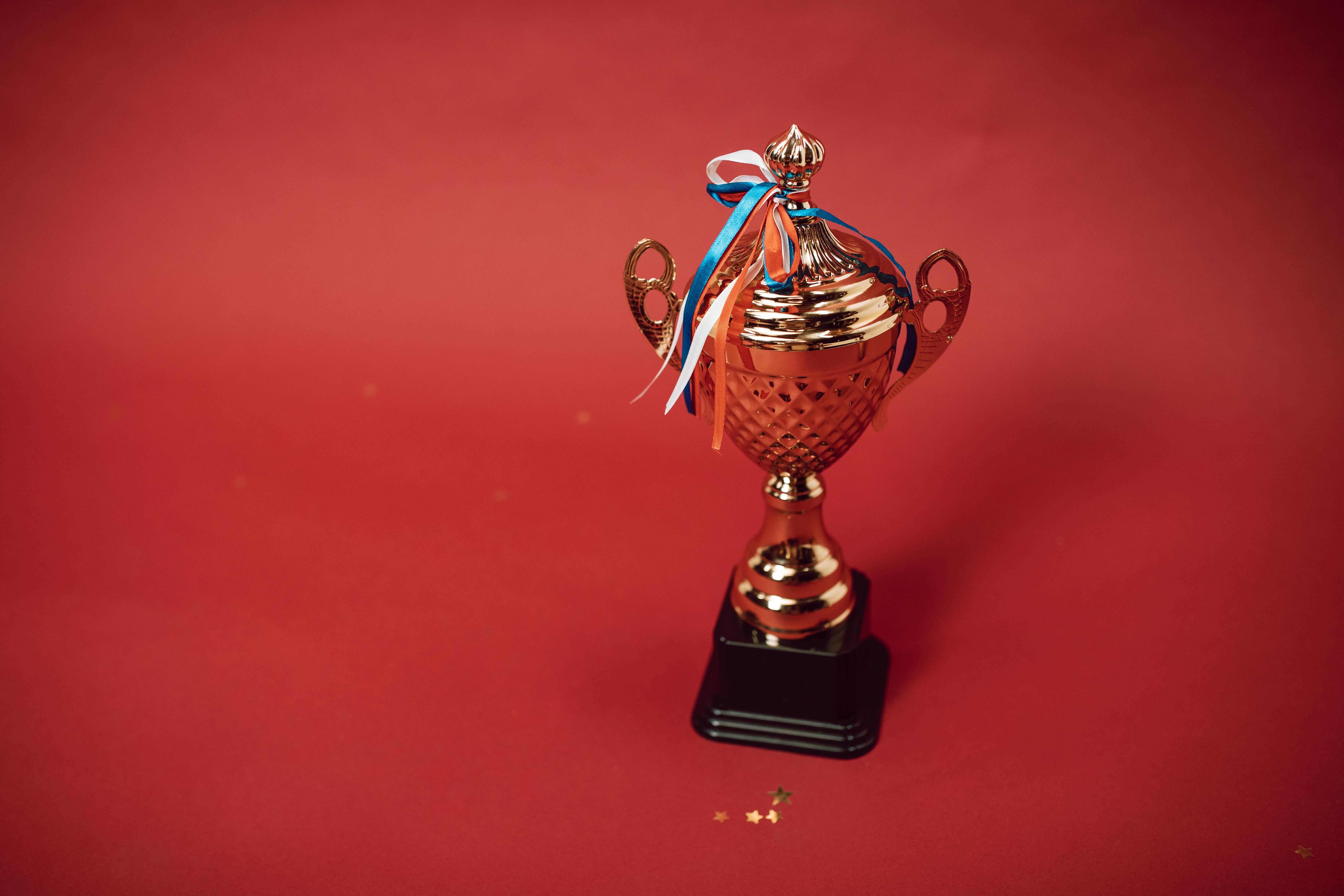 a trophy on a red background